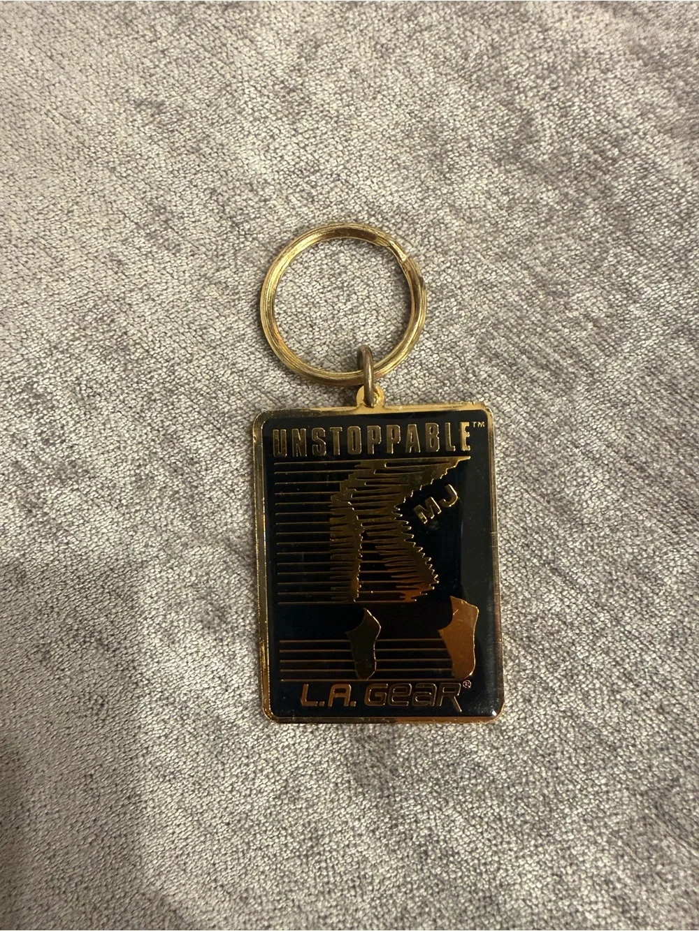 L.A. Gear Black and Gold 'Unstoppable' Rectangular Keychain